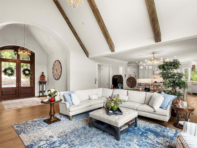 41 Bear Flower Trl, Arden, NC 28704 - living room with a chandelier, wood finished floors, beamed ceiling, high vaulted ceiling, and french doors