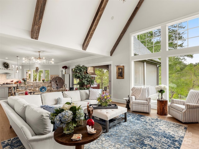 41 Bear Flower Trl, Arden, NC 28704 - living area featuring a chandelier, high vaulted ceiling, beam ceiling, plenty of natural light, and wood finished floors