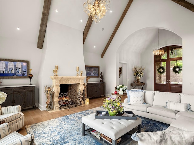 41 Bear Flower Trl, Arden, NC 28704 - living room with a chandelier, arched walkways, wood finished floors, baseboards, and recessed lighting