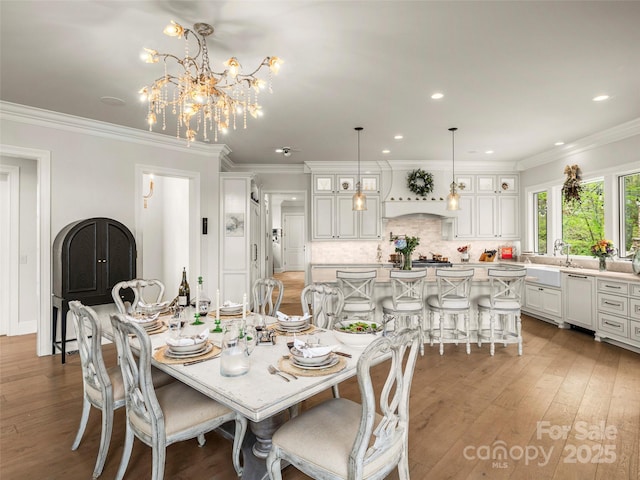 41 Bear Flower Trl, Arden, NC 28704 - dining area featuring light wood-type flooring, a chandelier, ornamental molding, and recessed lighting