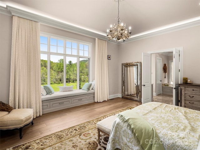 41 Bear Flower Trl, Arden, NC 28704 - bedroom with a chandelier, ornamental molding, and light wood-type flooring