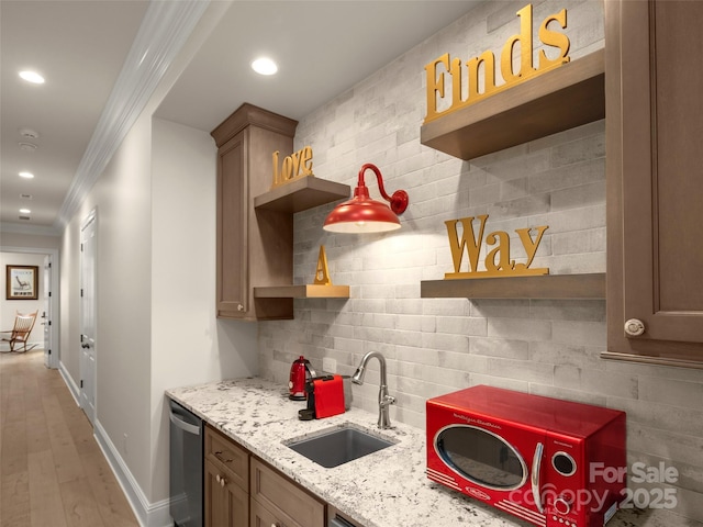 41 Bear Flower Trl, Arden, NC 28704 - kitchen with a sink, open shelves, ornamental molding, backsplash, and baseboards