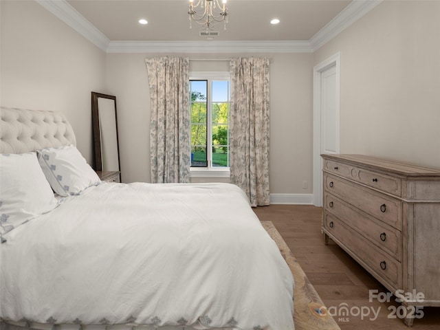 41 Bear Flower Trl, Arden, NC 28704 - bedroom with wood finished floors, crown molding, baseboards, a chandelier, and recessed lighting