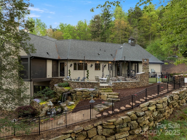 41 Bear Flower Trl, Arden, NC 28704 - view of front of home featuring a patio, a shingled roof, stucco siding, and stone siding