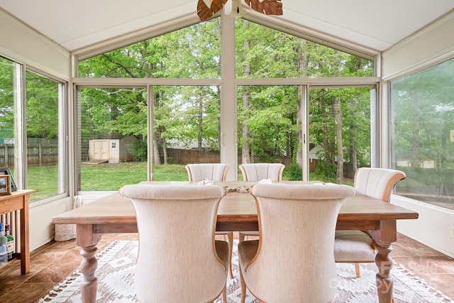 sunroom / solarium featuring vaulted ceiling