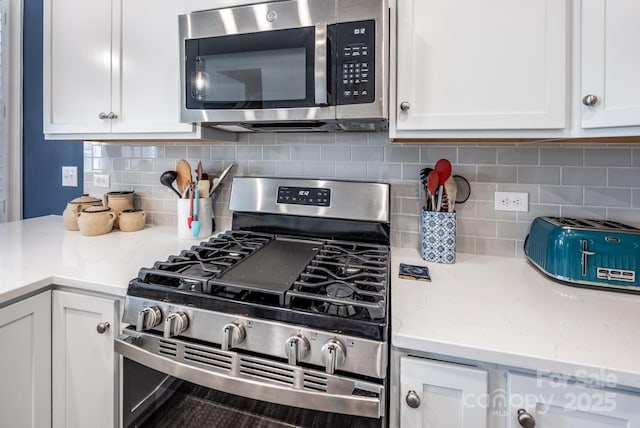 3619 Whitney Way, Terrell, NC 28682 - kitchen featuring appliances with stainless steel finishes, backsplash, and white cabinetry