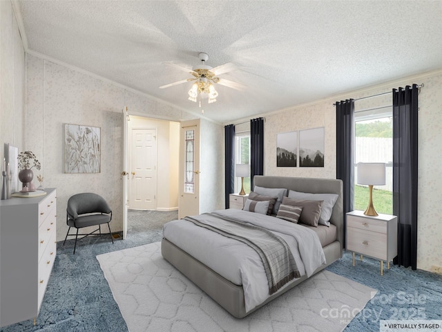 carpeted bedroom featuring a ceiling fan, ornamental molding, a textured ceiling, wallpapered walls, and lofted ceiling