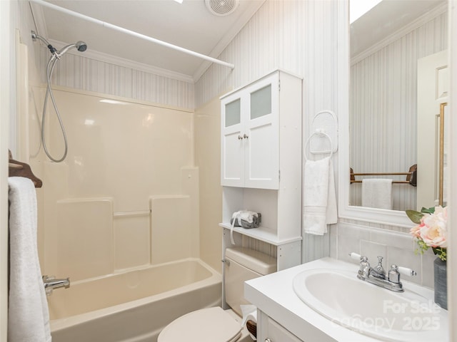 full bath featuring vanity, toilet, visible vents, ornamental molding, and  shower combination