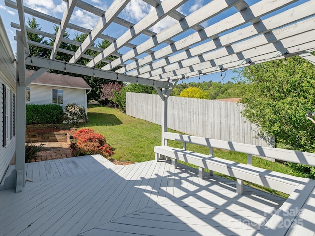 wooden deck featuring fence, a pergola, and a lawn