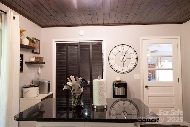 dining area with wooden ceiling and ornamental molding