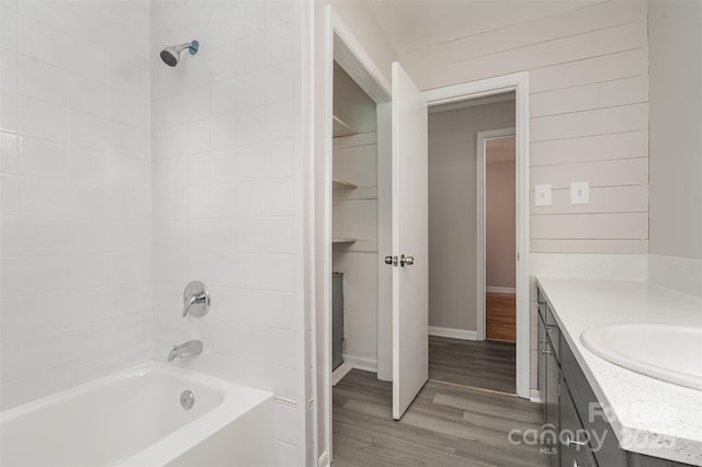 full bathroom featuring vanity and wood finished floors