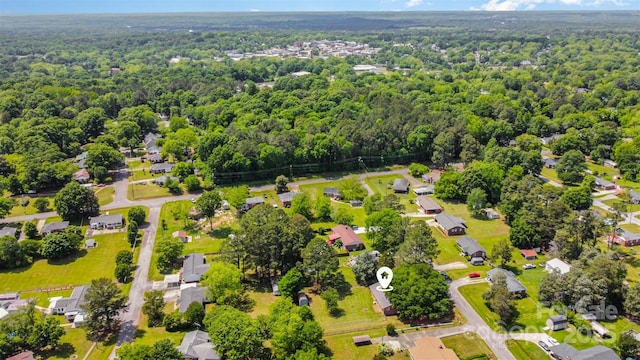 bird's eye view featuring a forest view