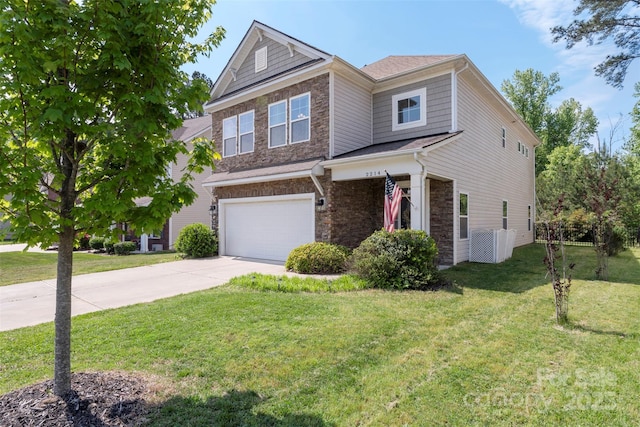 view of front of home with an attached garage, a front lawn, stone siding, and concrete driveway