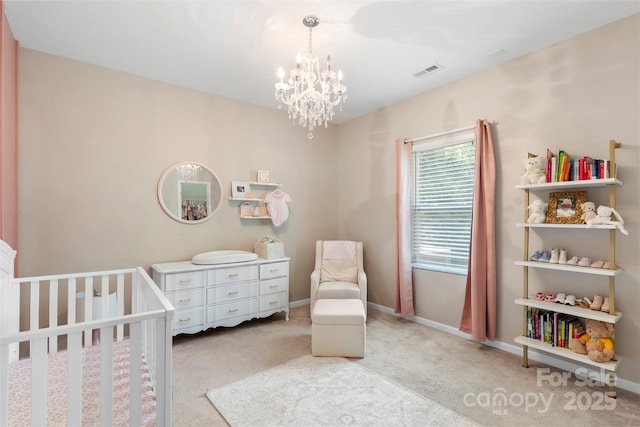 carpeted bedroom with visible vents, baseboards, a nursery area, and a chandelier
