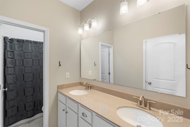 full bath featuring double vanity, a sink, a shower with shower curtain, and toilet