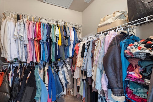 spacious closet featuring attic access