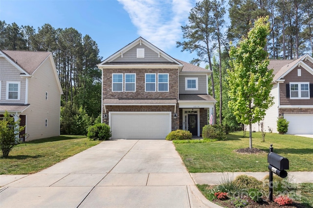 view of front of property with concrete driveway, stone siding, a front yard, and a garage