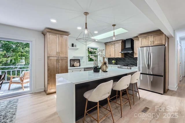 200 Kimrod Ln, Charlotte, NC 28270 - kitchen with freestanding refrigerator, wall chimney range hood, light wood-style flooring, open shelves, and recessed lighting