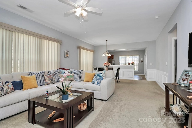 18020 Owl Ct, Indian Land, SC 29707 - living area featuring carpet flooring, wainscoting, a decorative wall, a ceiling fan, and visible vents