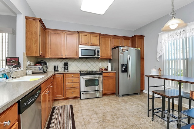 18020 Owl Ct, Indian Land, SC 29707 - kitchen with brown cabinets, appliances with stainless steel finishes, and a sink