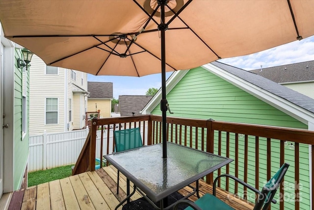 wooden deck with outdoor dining area
