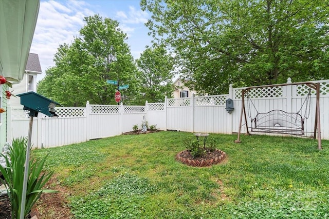 view of yard with a fenced backyard
