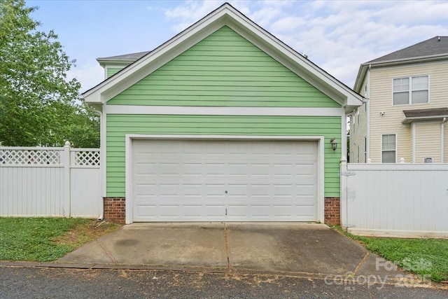 garage with fence