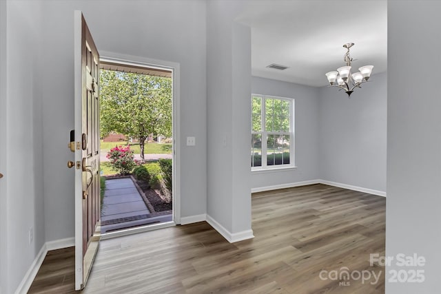 1218 Faversham Ln, Rock Hill, SC 29730 - entryway featuring a chandelier and wood finished floors