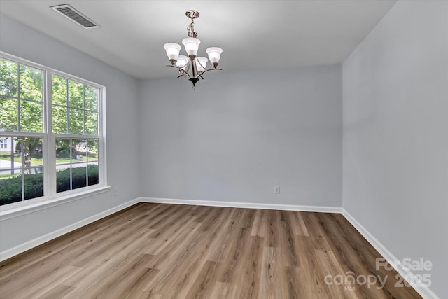 1218 Faversham Ln, Rock Hill, SC 29730 - unfurnished room featuring a chandelier and wood finished floors