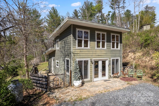 view of front of property with french doors and a patio area