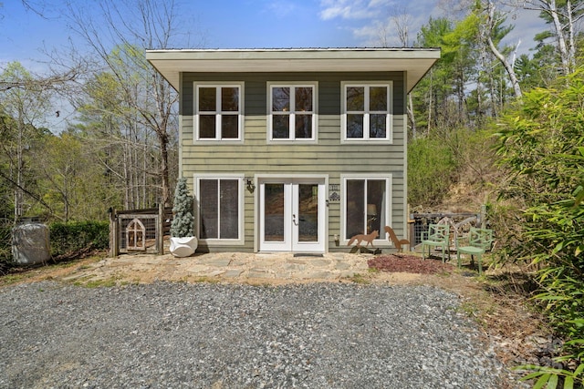 rear view of property with french doors