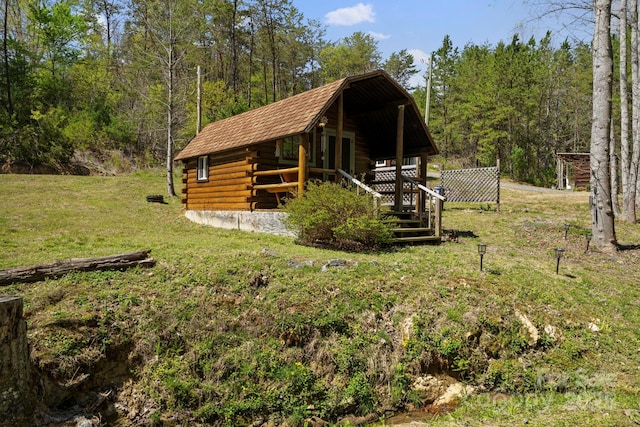 exterior space featuring a view of trees