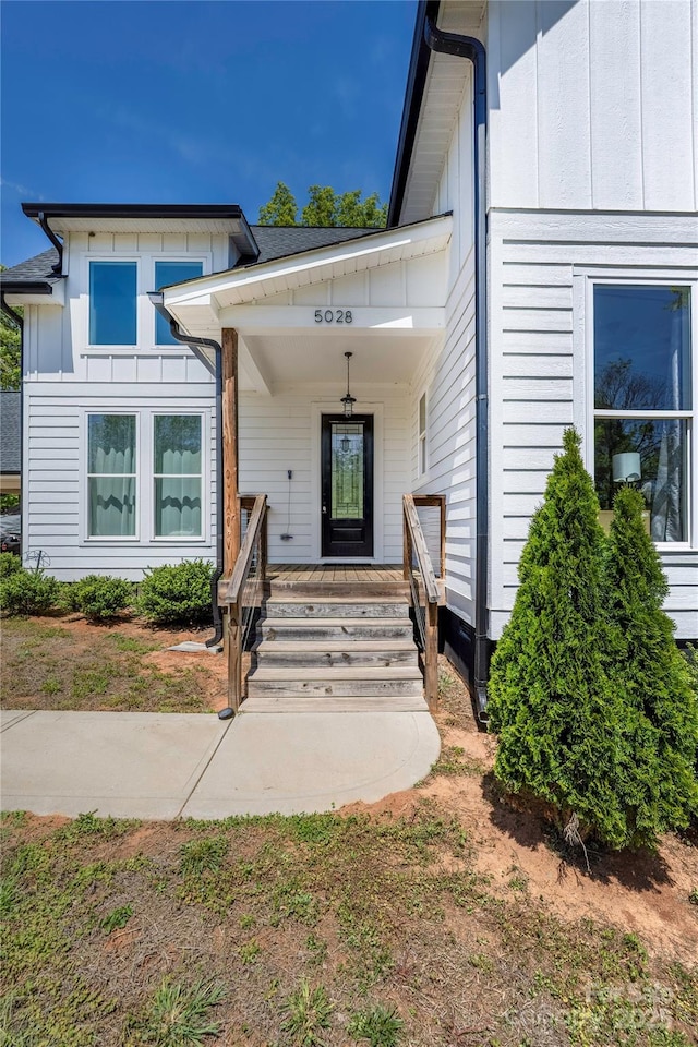 5028 Lewis Rd, Gastonia, NC 28052 - doorway to property with board and batten siding and covered porch