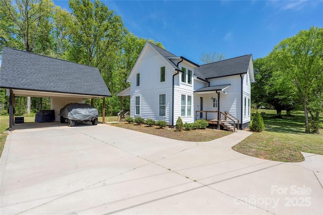 5028 Lewis Rd, Gastonia, NC 28052 - view of property exterior with board and batten siding, concrete driveway, a yard, and a shingled roof