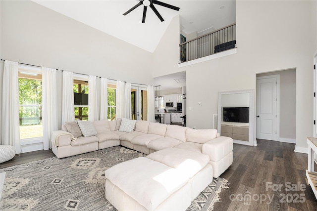 5028 Lewis Rd, Gastonia, NC 28052 - living room featuring ceiling fan, high vaulted ceiling, dark wood-type flooring, and baseboards