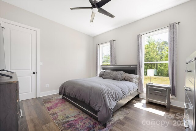 5028 Lewis Rd, Gastonia, NC 28052 - bedroom with dark wood-type flooring, baseboards, and ceiling fan