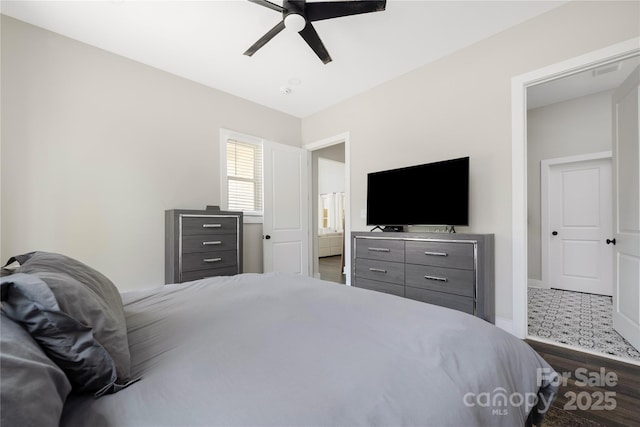 5028 Lewis Rd, Gastonia, NC 28052 - bedroom with dark wood finished floors, ceiling fan, and baseboards