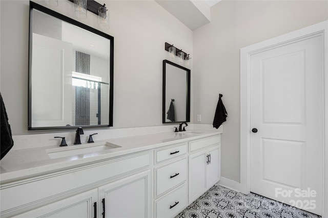 5028 Lewis Rd, Gastonia, NC 28052 - full bath featuring double vanity, tile patterned flooring, and baseboards
