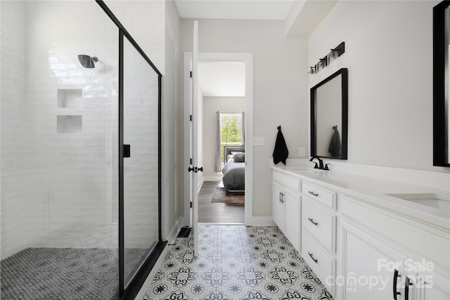 5028 Lewis Rd, Gastonia, NC 28052 - full bathroom with a shower stall, connected bathroom, double vanity, and tile patterned flooring