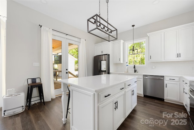5028 Lewis Rd, Gastonia, NC 28052 - kitchen with stainless steel appliances, dark wood finished floors, plenty of natural light, and a sink