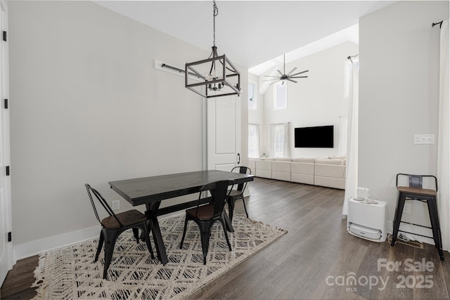 5028 Lewis Rd, Gastonia, NC 28052 - dining room featuring wood finished floors, a chandelier, ceiling fan, and baseboards