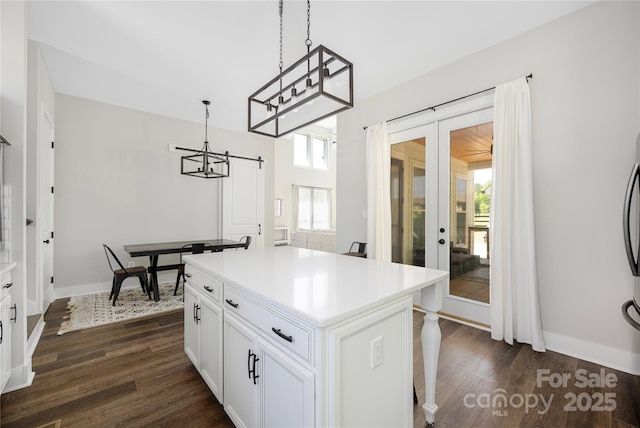 5028 Lewis Rd, Gastonia, NC 28052 - kitchen with french doors, dark wood finished floors, white cabinetry, and baseboards