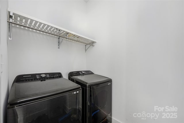 5028 Lewis Rd, Gastonia, NC 28052 - washroom with washing machine and clothes dryer and baseboards