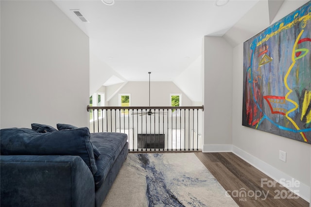 5028 Lewis Rd, Gastonia, NC 28052 - living room with wood finished floors, baseboards, and vaulted ceiling