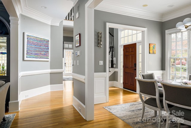 4324 Doverstone Ln, Greensboro, NC 27407 - foyer featuring light wood-type flooring and ornamental molding
