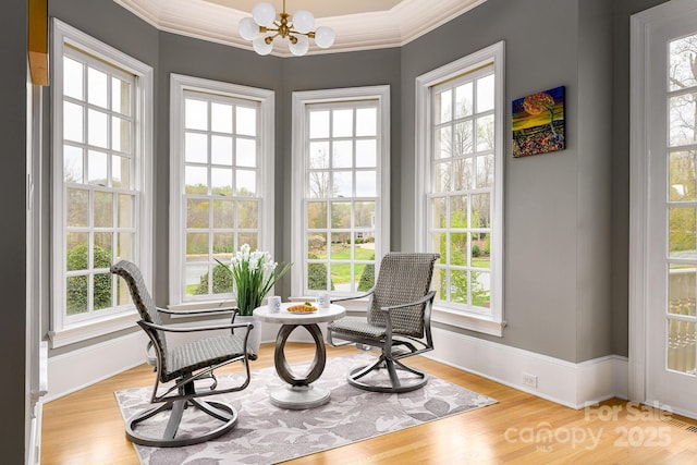 4324 Doverstone Ln, Greensboro, NC 27407 - sitting room with an inviting chandelier, ornamental molding, wood finished floors, and visible vents