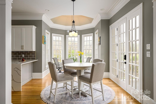 4324 Doverstone Ln, Greensboro, NC 27407 - dining area with baseboards, ornamental molding, and light wood-style floors