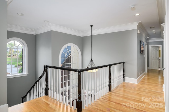 4324 Doverstone Ln, Greensboro, NC 27407 - corridor featuring baseboards, an upstairs landing, ornamental molding, and wood finished floors