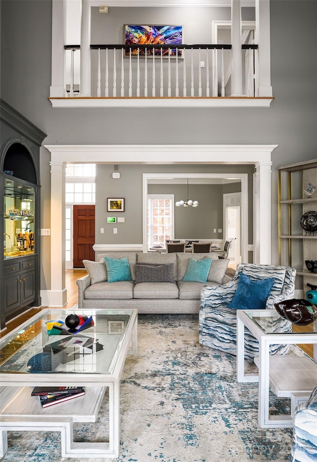 4324 Doverstone Ln, Greensboro, NC 27407 - living area with an inviting chandelier and a towering ceiling
