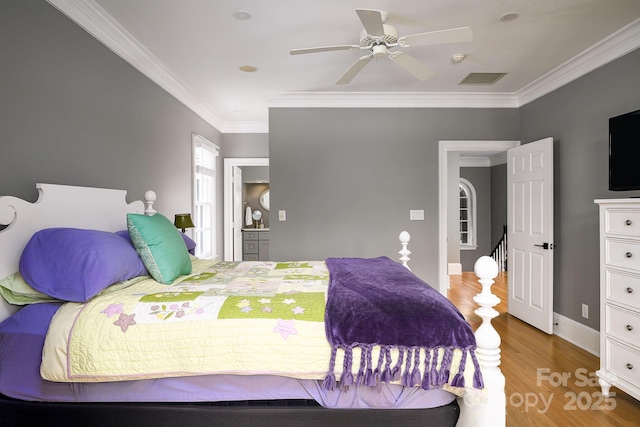 4324 Doverstone Ln, Greensboro, NC 27407 - bedroom with ceiling fan, visible vents, crown molding, wood finished floors, and baseboards